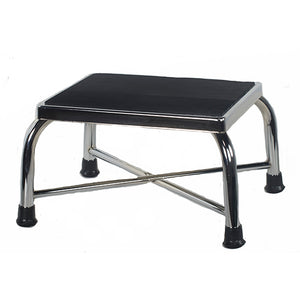 Step stool with black top and chrome frame on a white background